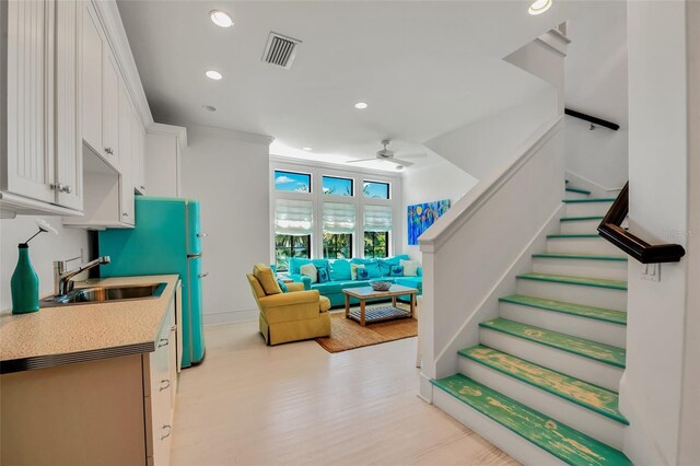 103 Park Ave, Anna Maria, FL 34216 - staircase with baseboards, visible vents, recessed lighting, wood finished floors, and ceiling fan