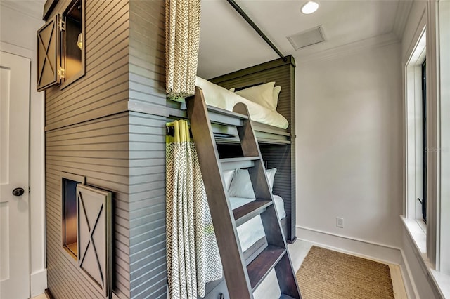 103 Park Ave, Anna Maria, FL 34216 - details with wooden walls, baseboards, ornamental molding, visible vents, and recessed lighting