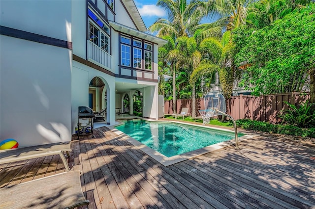 103 Park Ave, Anna Maria, FL 34216 - view of swimming pool featuring a fenced backyard, a wooden deck, a grill, and a fenced in pool