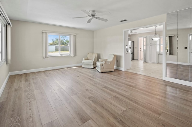 214 49th St W, Bradenton, FL 34209 - unfurnished room with ceiling fan, baseboards, light wood-style floors, and visible vents