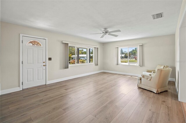 214 49th St W, Bradenton, FL 34209 - foyer entrance with baseboards, wood finished floors, visible vents, and ceiling fan