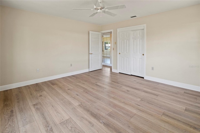 214 49th St W, Bradenton, FL 34209 - unfurnished bedroom featuring baseboards, light wood-style flooring, visible vents, and a closet