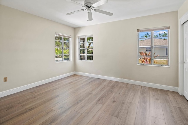 214 49th St W, Bradenton, FL 34209 - unfurnished room featuring ceiling fan, baseboards, light wood-type flooring, and a wealth of natural light