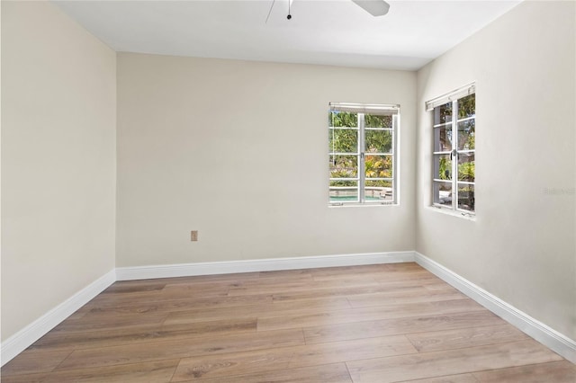 214 49th St W, Bradenton, FL 34209 - spare room with light wood-type flooring, a ceiling fan, and baseboards