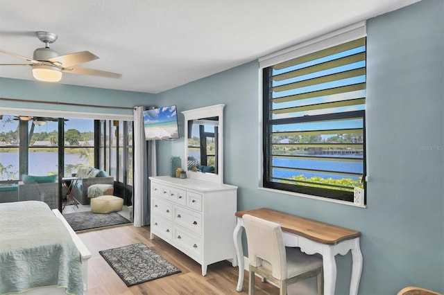 bedroom featuring light wood finished floors and ceiling fan