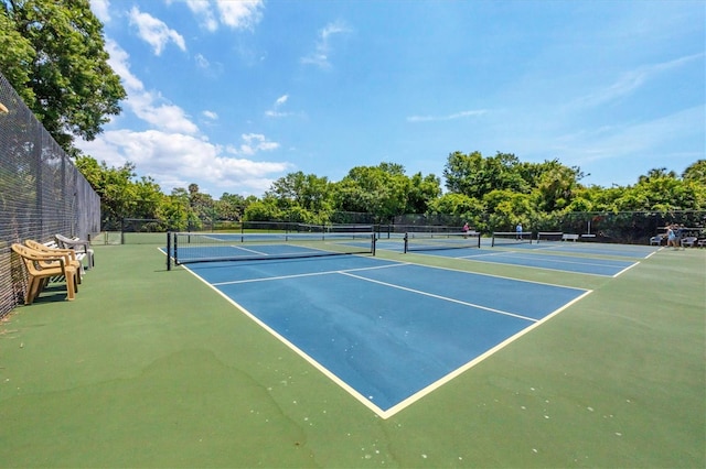 view of sport court with fence