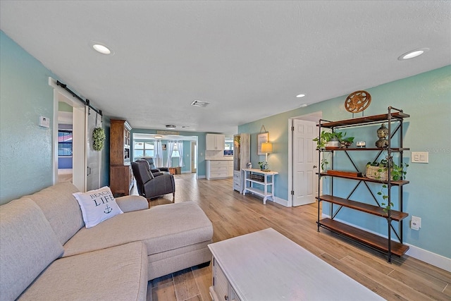 130 E Seminole Dr, Venice, FL 34293 - living area featuring recessed lighting, a barn door, and light wood-type flooring