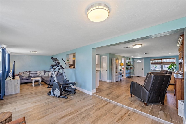 130 E Seminole Dr, Venice, FL 34293 - workout room featuring wood finished floors, baseboards, and visible vents