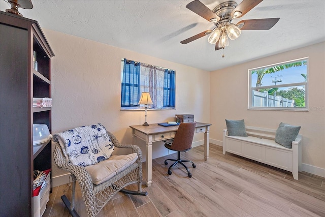 130 E Seminole Dr, Venice, FL 34293 - home office featuring ceiling fan, baseboards, wood finished floors, and a textured ceiling