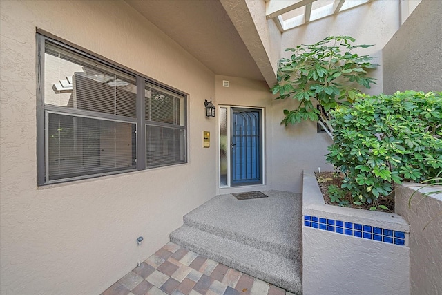 1612 Starling Dr Unit 101, Sarasota, FL 34231 - doorway to property with stucco siding