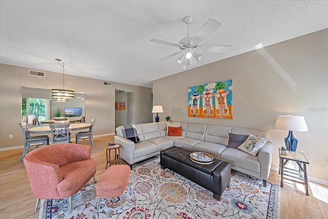 1612 Starling Dr Unit 101, Sarasota, FL 34231 - living area with wood finished floors, baseboards, and visible vents