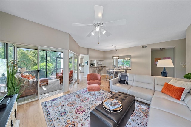 1612 Starling Dr Unit 101, Sarasota, FL 34231 - living area with visible vents, a ceiling fan, and light wood-style floors