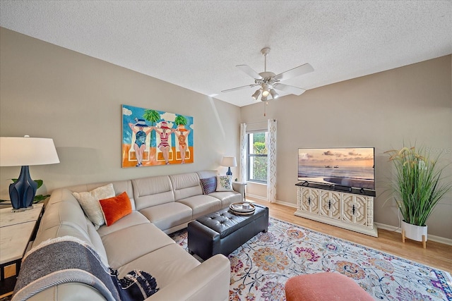 1612 Starling Dr Unit 101, Sarasota, FL 34231 - living area featuring ceiling fan, baseboards, wood finished floors, and a textured ceiling