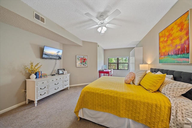 1612 Starling Dr Unit 101, Sarasota, FL 34231 - carpeted bedroom with a textured ceiling, ceiling fan, baseboards, and visible vents