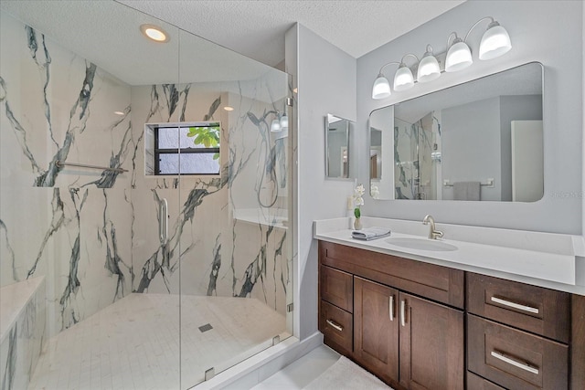 1612 Starling Dr Unit 101, Sarasota, FL 34231 - full bath featuring a marble finish shower, recessed lighting, vanity, and a textured ceiling