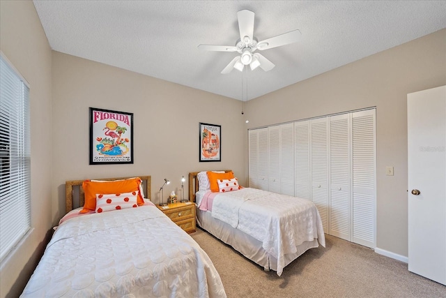 1612 Starling Dr Unit 101, Sarasota, FL 34231 - bedroom with a closet, a ceiling fan, light colored carpet, and multiple windows
