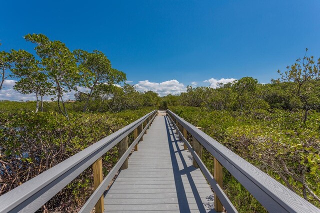 1612 Starling Dr Unit 101, Sarasota, FL 34231 - view of dock featuring a forest view