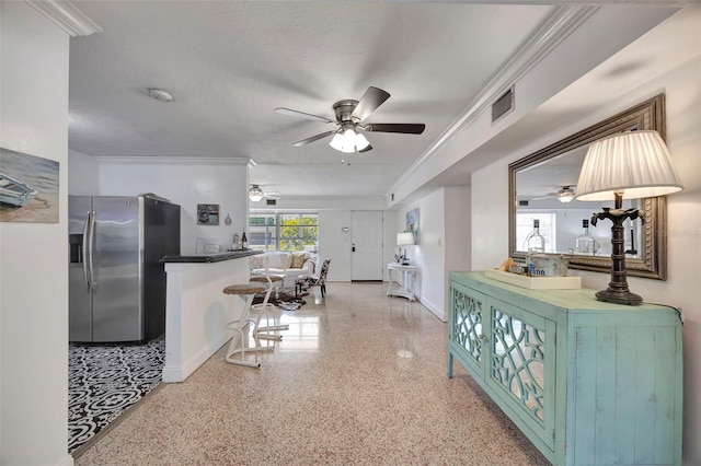 2307 Valencia Dr, Sarasota, FL 34239 - interior space with speckled floor, a ceiling fan, visible vents, and stainless steel fridge