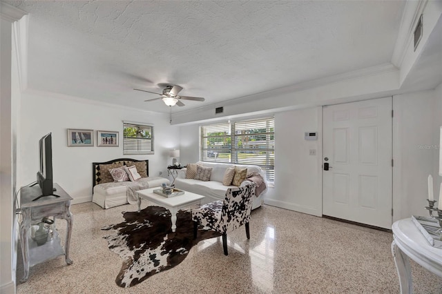 2307 Valencia Dr, Sarasota, FL 34239 - living area featuring baseboards, speckled floor, and crown molding