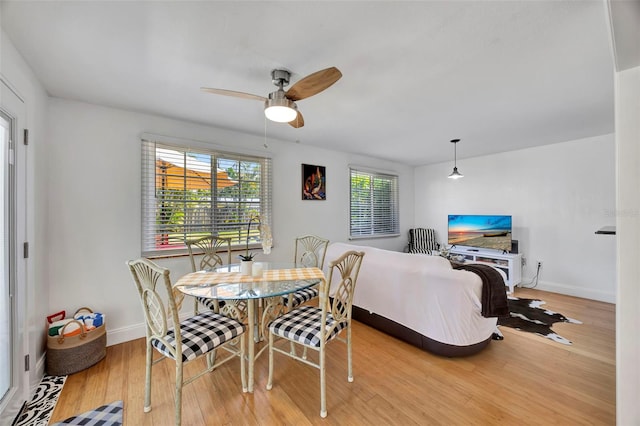 2307 Valencia Dr, Sarasota, FL 34239 - dining room featuring baseboards, a ceiling fan, and wood finished floors