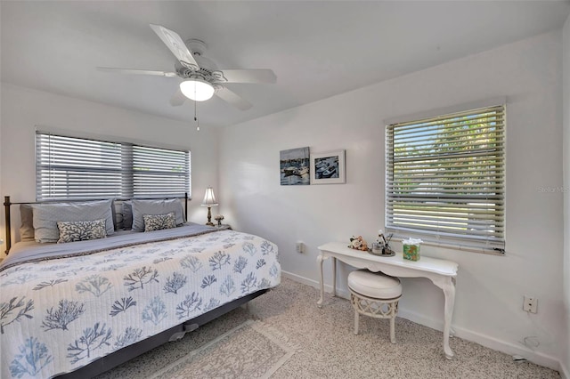 2307 Valencia Dr, Sarasota, FL 34239 - bedroom with ceiling fan, baseboards, and carpet flooring