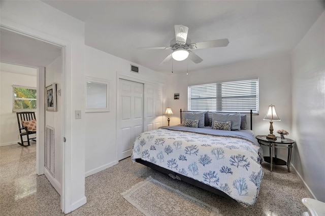 2307 Valencia Dr, Sarasota, FL 34239 - bedroom featuring a closet, baseboards, and multiple windows