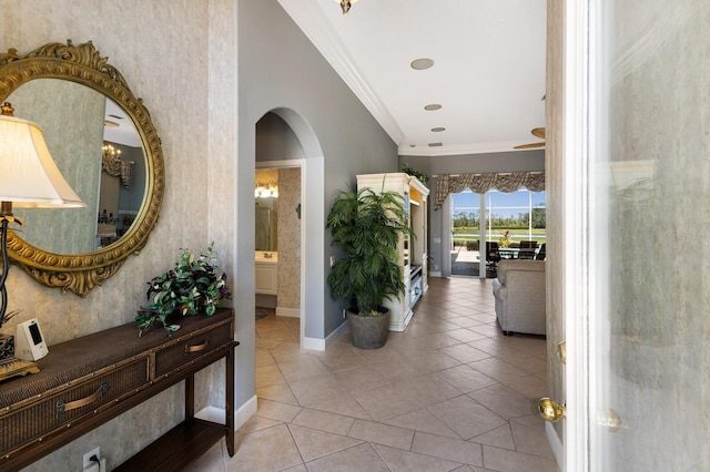 8715 52nd Ave E, Bradenton, FL 34211 - hallway featuring arched walkways, crown molding, and tile patterned flooring
