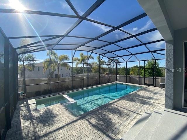 1142 Blarney St, Minneola, FL 34715 - view of pool featuring a lanai, a patio area, and a pool with connected hot tub