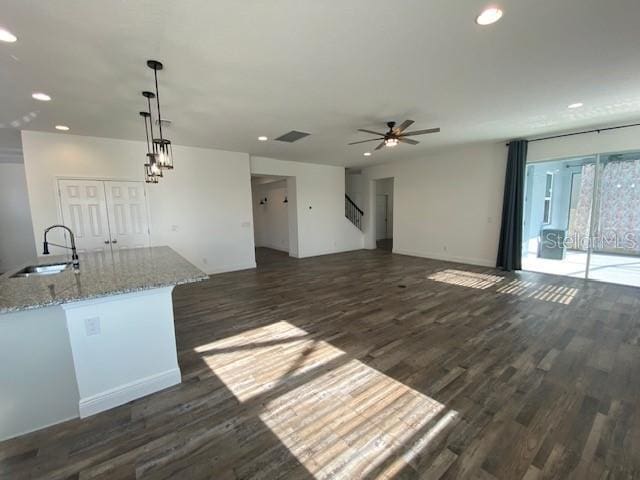 1142 Blarney St, Minneola, FL 34715 - unfurnished living room with a ceiling fan, a sink, dark wood finished floors, and recessed lighting