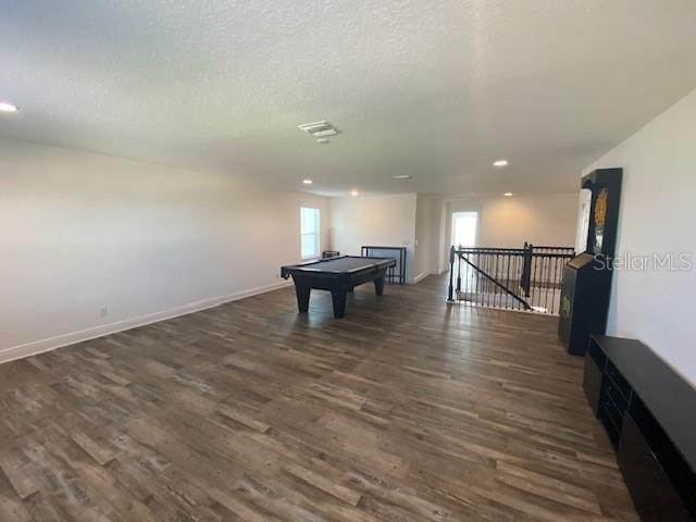 1142 Blarney St, Minneola, FL 34715 - playroom with visible vents, baseboards, a textured ceiling, dark wood-style floors, and recessed lighting
