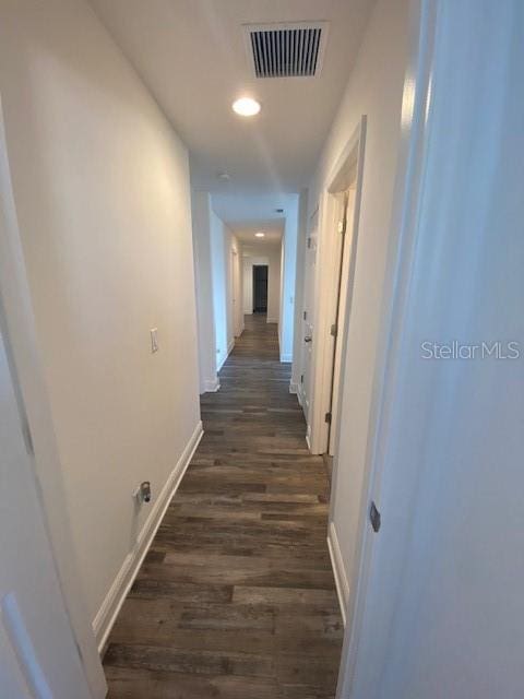 1142 Blarney St, Minneola, FL 34715 - corridor featuring dark wood-type flooring, visible vents, baseboards, and recessed lighting