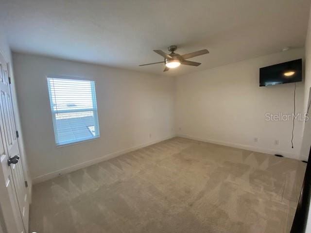 1142 Blarney St, Minneola, FL 34715 - unfurnished room featuring light colored carpet, ceiling fan, and baseboards