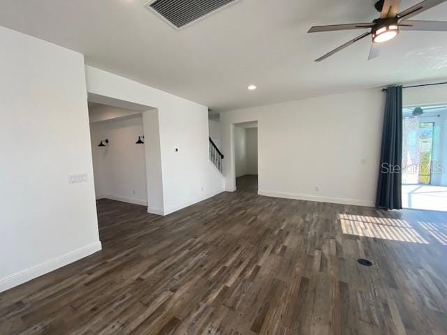 1142 Blarney St, Minneola, FL 34715 - unfurnished living room with dark wood-style flooring, recessed lighting, stairs, visible vents, and ceiling fan