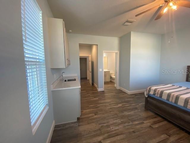 1142 Blarney St, Minneola, FL 34715 - bedroom with baseboards, a ceiling fan, visible vents, dark wood finished floors, and a sink