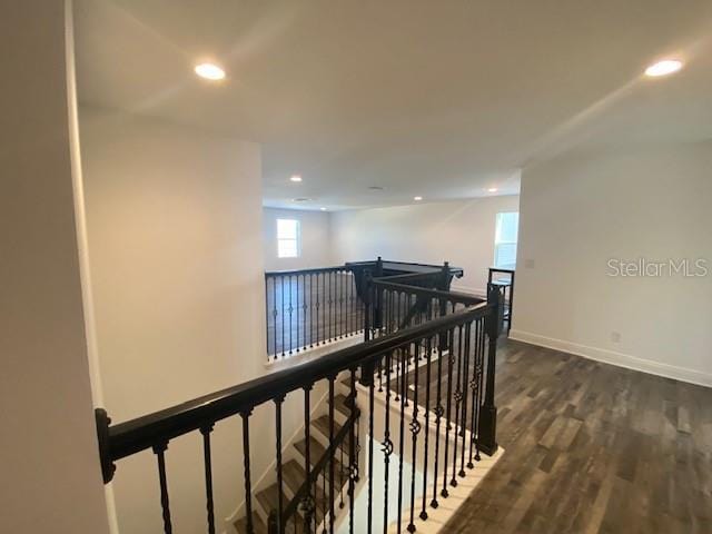 1142 Blarney St, Minneola, FL 34715 - corridor featuring wood finished floors, baseboards, an upstairs landing, and recessed lighting