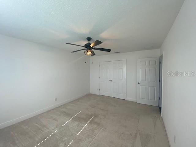 1142 Blarney St, Minneola, FL 34715 - unfurnished bedroom featuring a closet, baseboards, and a ceiling fan