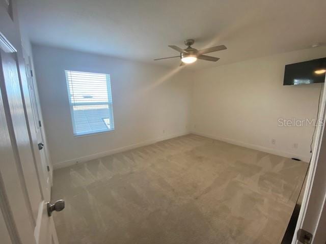 1142 Blarney St, Minneola, FL 34715 - empty room featuring ceiling fan, baseboards, and light colored carpet
