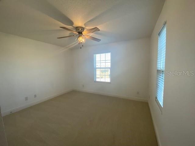 1142 Blarney St, Minneola, FL 34715 - unfurnished room with ceiling fan, light colored carpet, and baseboards