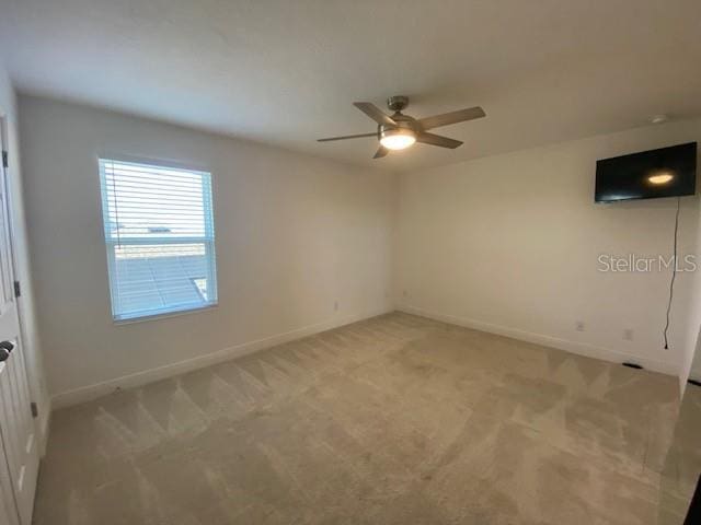 1142 Blarney St, Minneola, FL 34715 - spare room with ceiling fan, baseboards, and light carpet