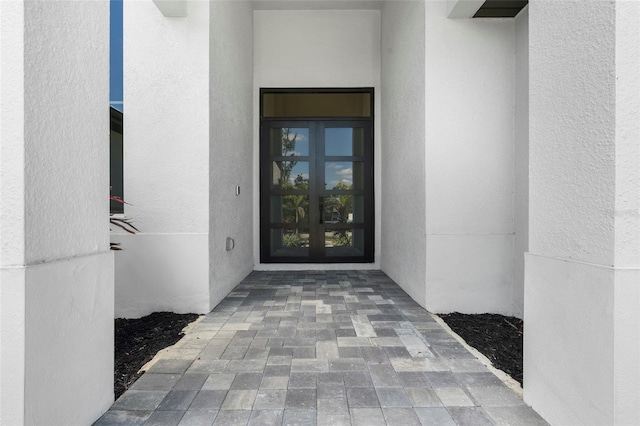 3724 SW 3rd St, Cape Coral, FL 33991 - property entrance featuring french doors and stucco siding