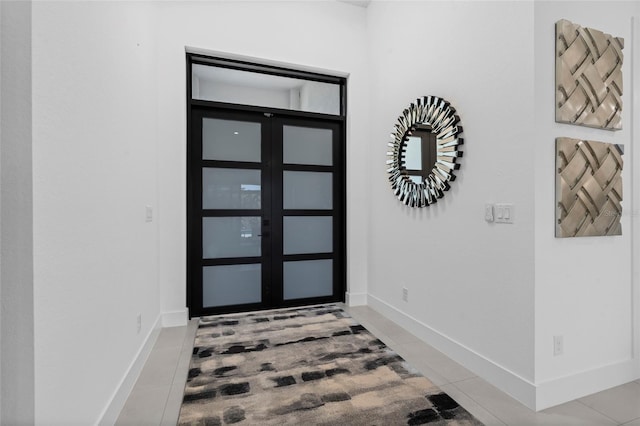 3724 SW 3rd St, Cape Coral, FL 33991 - entryway with light tile patterned floors and baseboards