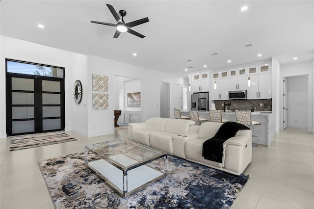 3724 SW 3rd St, Cape Coral, FL 33991 - living room with light tile patterned floors, a ceiling fan, and recessed lighting
