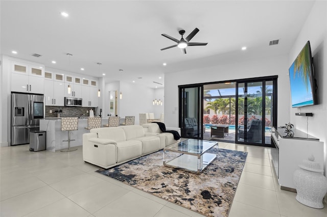3724 SW 3rd St, Cape Coral, FL 33991 - living room with light tile patterned floors, ceiling fan, visible vents, and recessed lighting