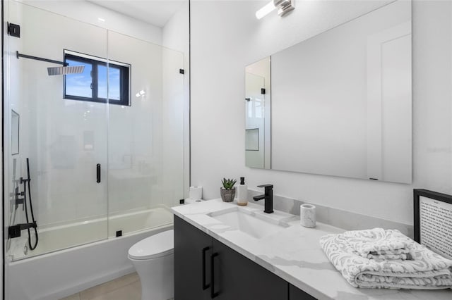 3724 SW 3rd St, Cape Coral, FL 33991 - bathroom with combined bath / shower with glass door, toilet, vanity, and tile patterned flooring