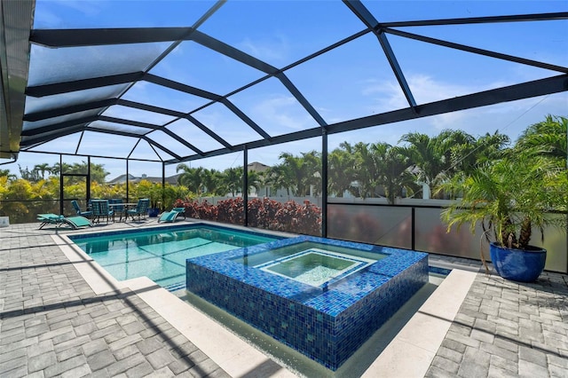 3724 SW 3rd St, Cape Coral, FL 33991 - view of swimming pool with a patio, a pool with connected hot tub, and glass enclosure