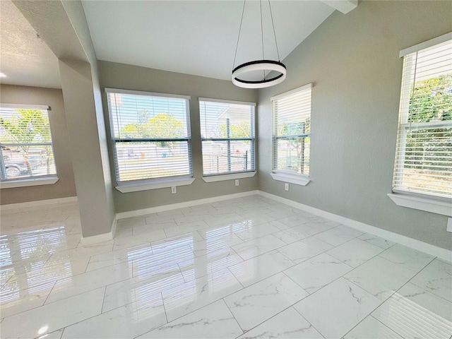 1142 Newhope Rd, Spring Hill, FL 34606 - unfurnished dining area featuring marble finish floor, baseboards, and lofted ceiling