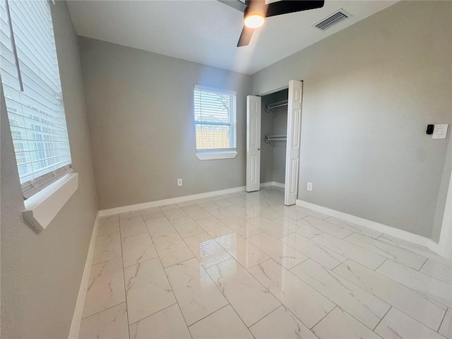 1142 Newhope Rd, Spring Hill, FL 34606 - unfurnished bedroom with visible vents, baseboards, marble finish floor, a closet, and ceiling fan