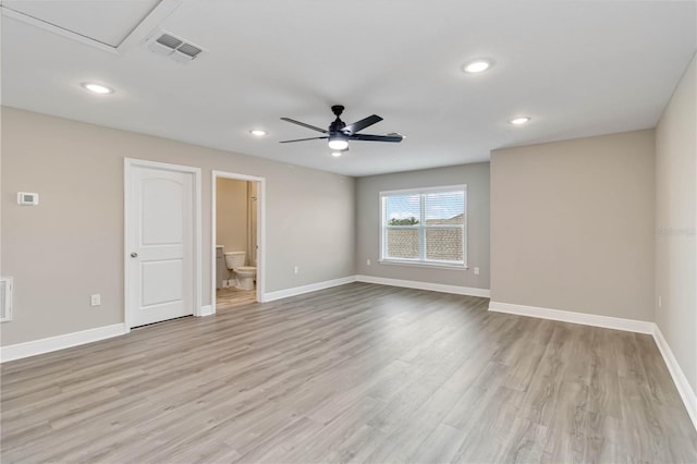 empty room with visible vents, ceiling fan, light wood-type flooring, and baseboards