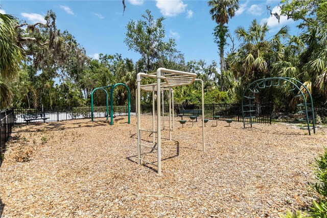 communal playground featuring fence