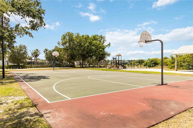 view of sport court featuring playground community and community basketball court